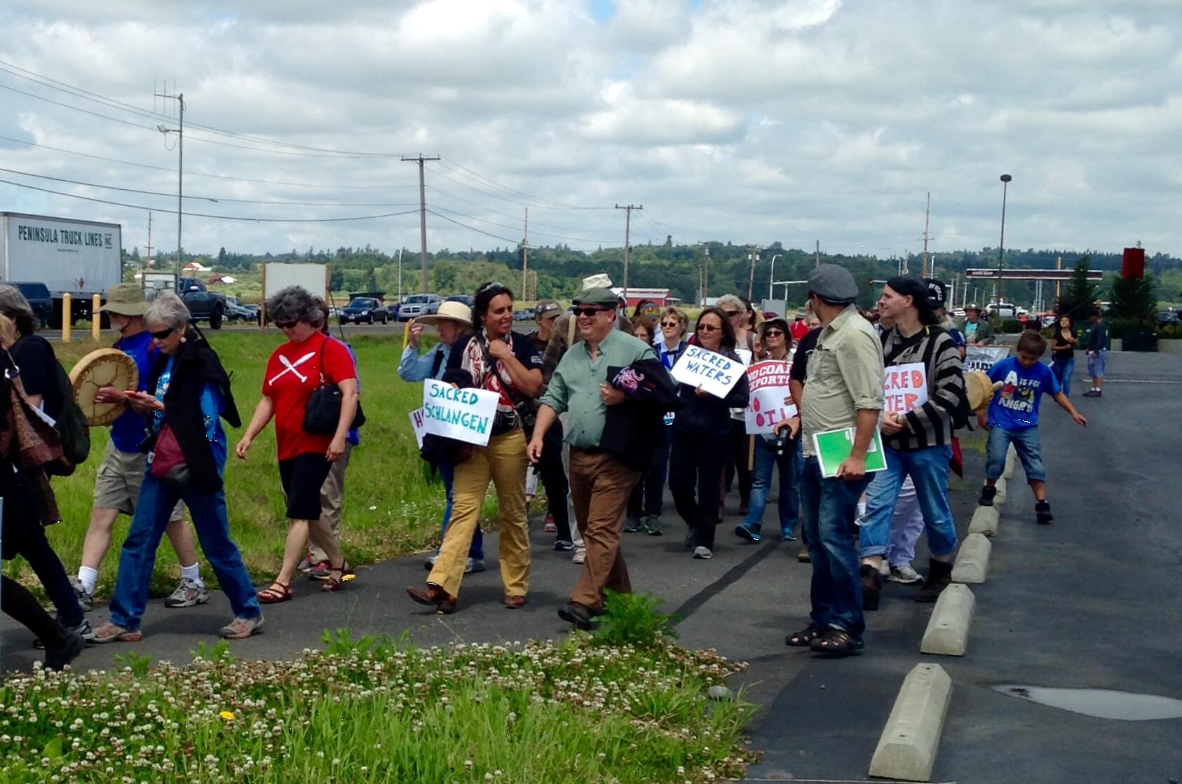 Supporters of sacred lands and waters embarked on this Sacred Walk during Lummi Stommish Water Festival June 2014
